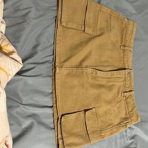 Never wore cargo khaki skirt. It s size large and fits like a mini skirt.